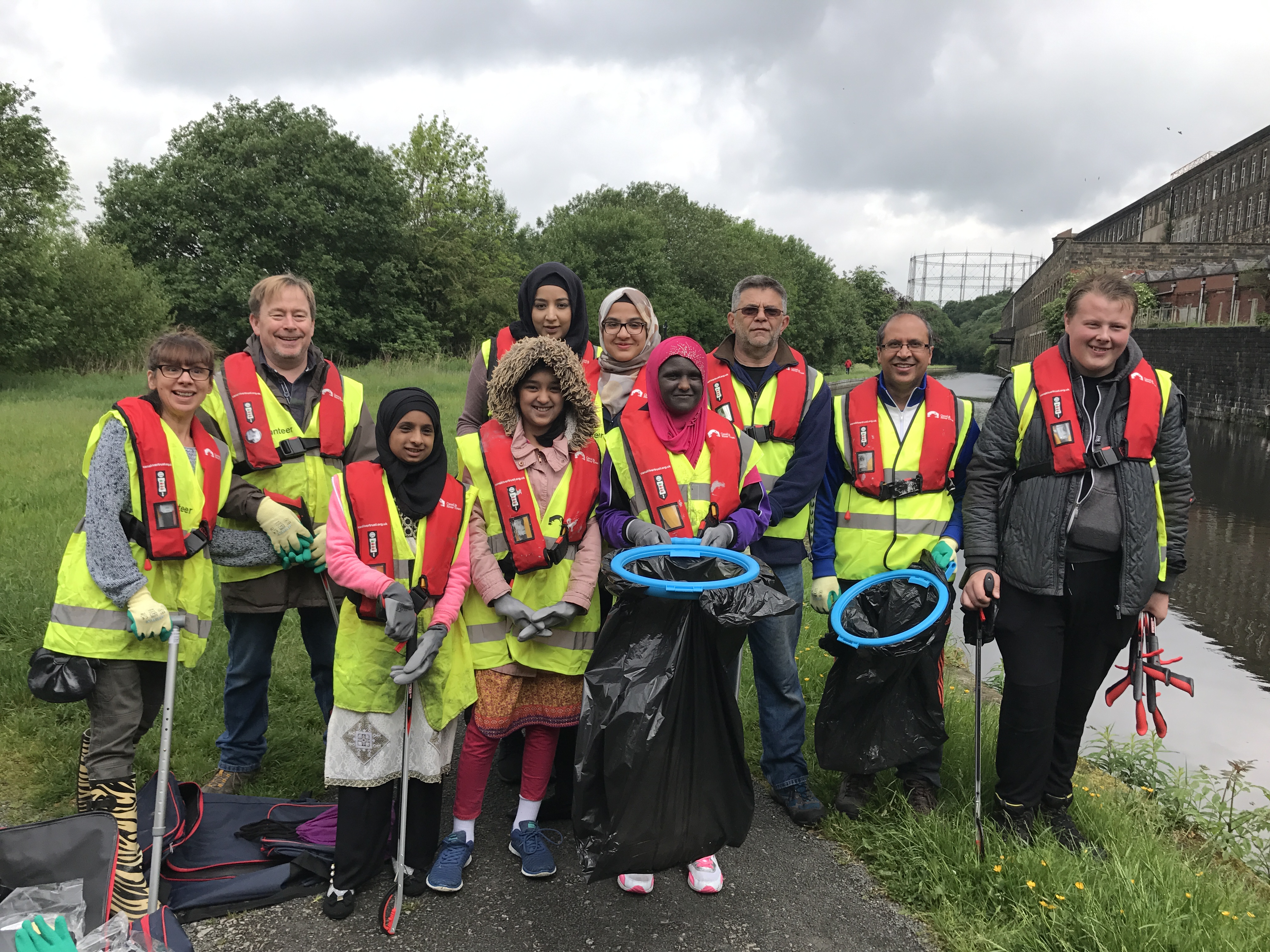 A photo showing Brierfield Action in the Community Youth Panel volunteers and local residents at the clean up