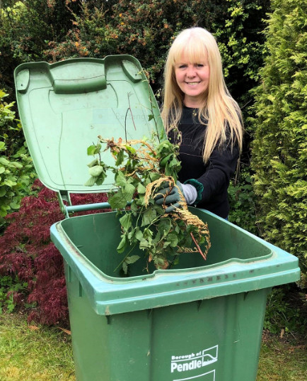 Photo of Carole Taylor with her garden waste bin
