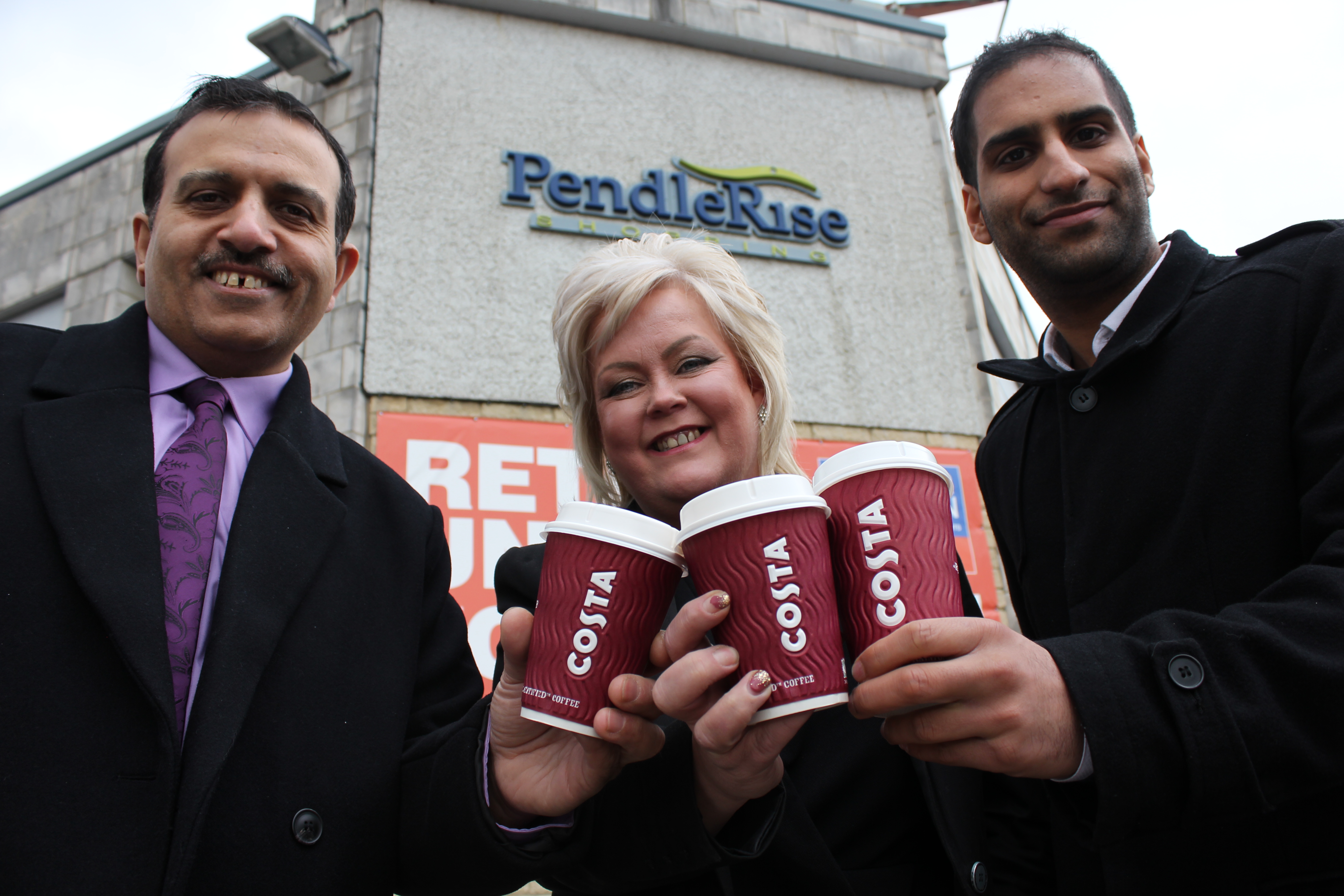 A photo feature Cllr Iqbal, Debbie Hernon of Pendle Rise and Hassan Ditta of Pendle Council