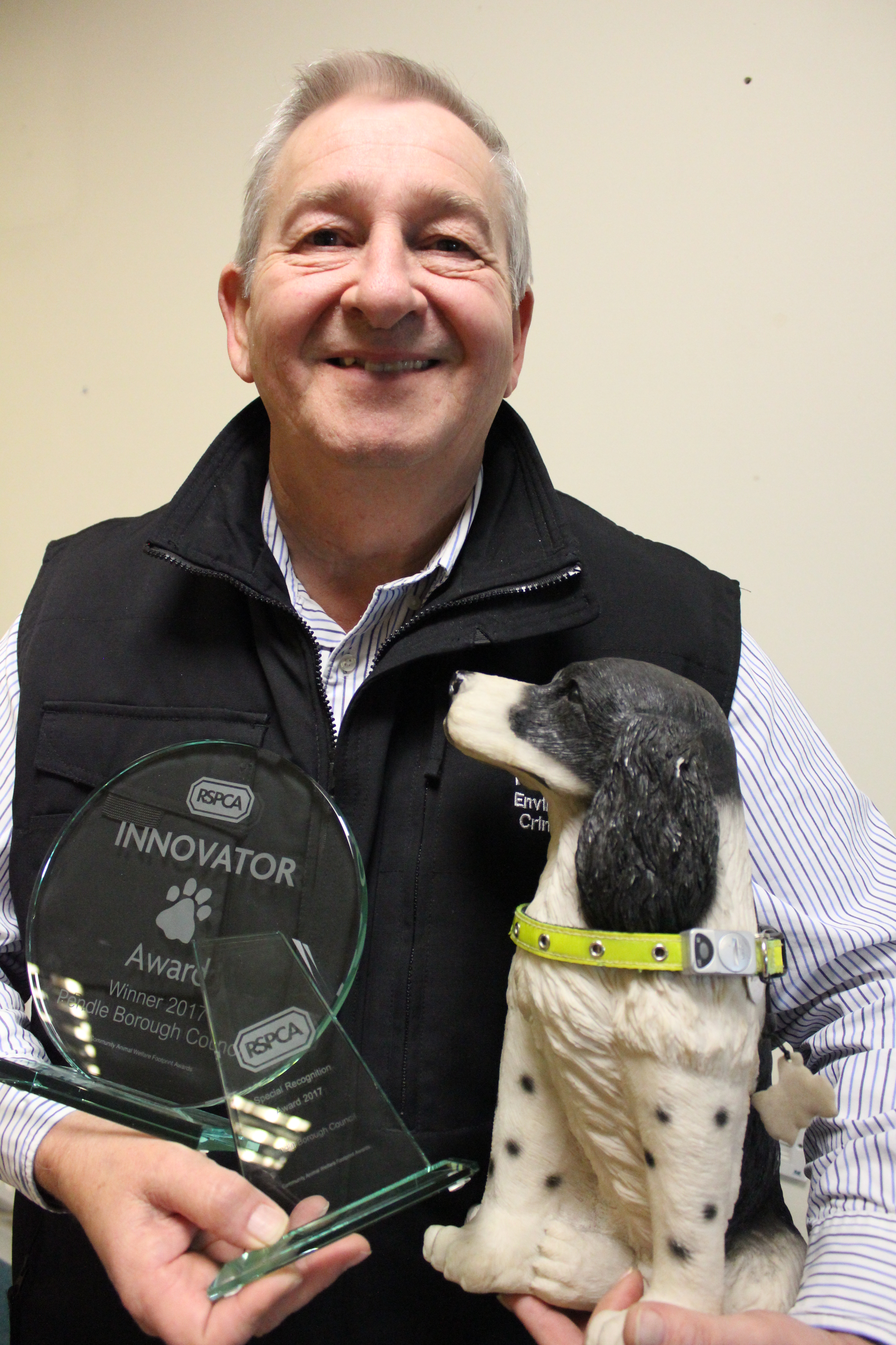 David Alexander with some of the Gold Pawprint awards.