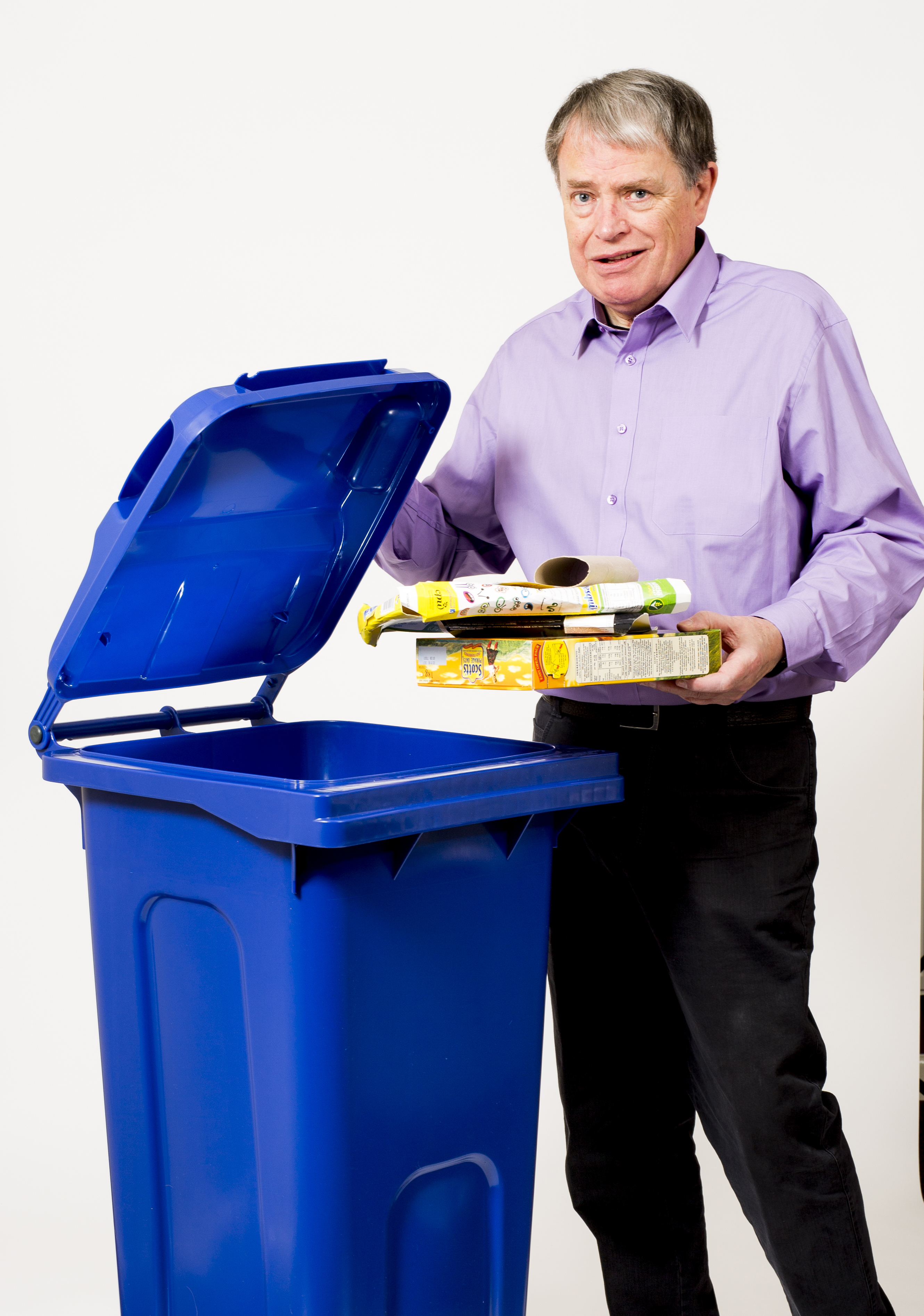 Photo of Cllr David Clegg with blue bin.
