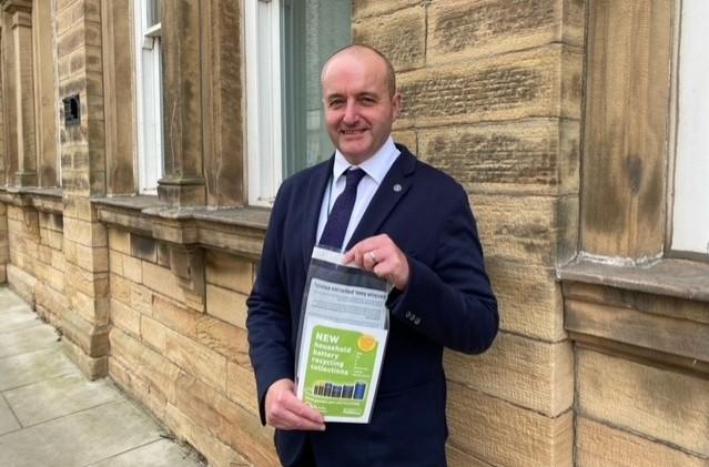 David walker with battery recycling leaflet