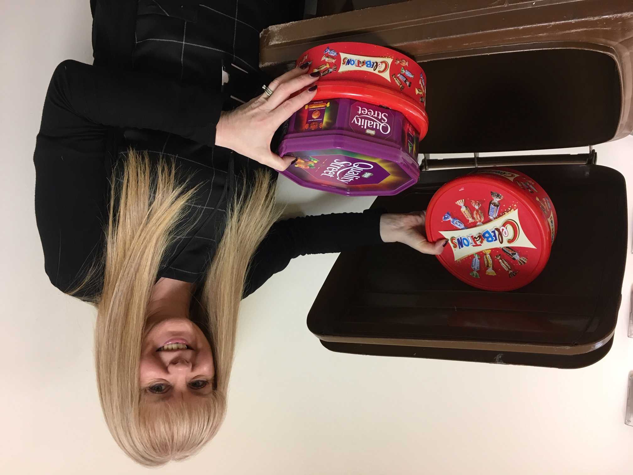 Carole Taylor with examples of plastic chocolate tubs you can recycle in your brown bin